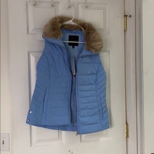 Blue puffer vest with fur lined collar